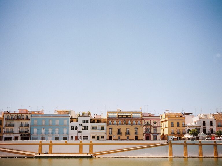 A photograph of Calle Betis in Seville on a sunny day, over the water