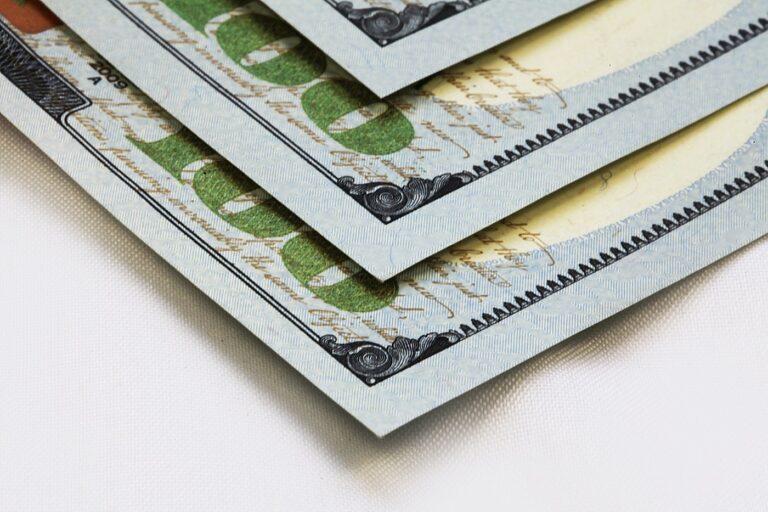 Close up on several one-hundred dollar bills