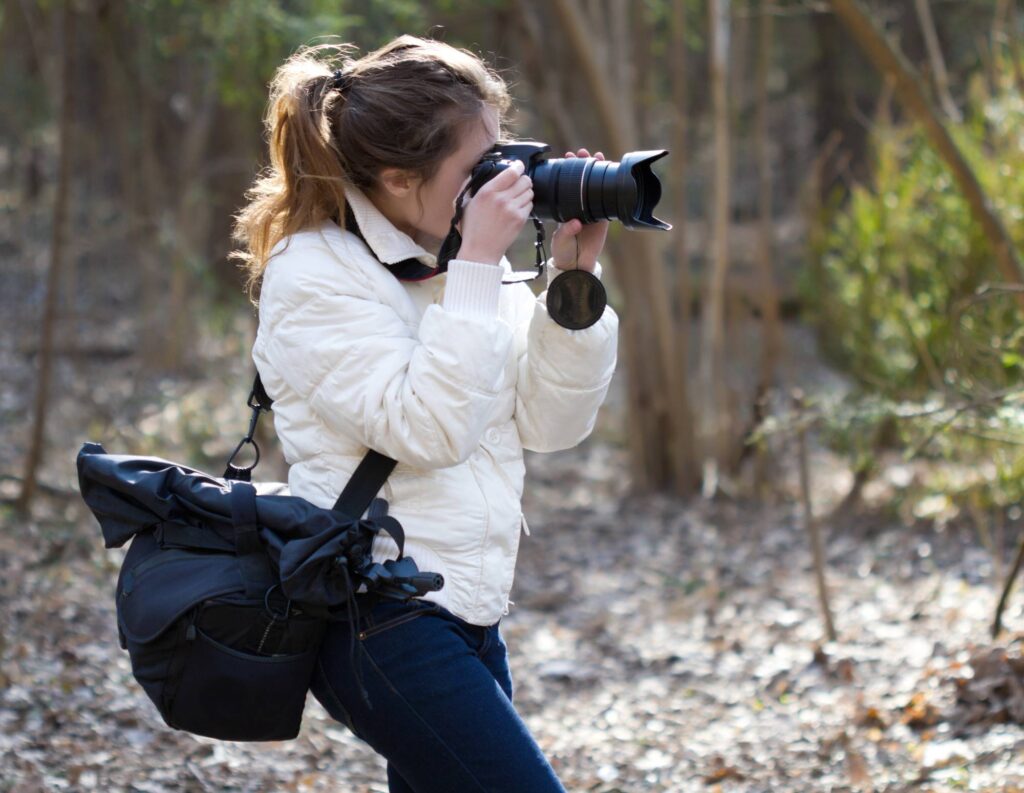Female photographer taking photos outdoors