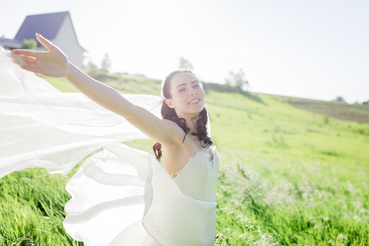 Bride in a open field at a Rising Tide Society Styled Shoot