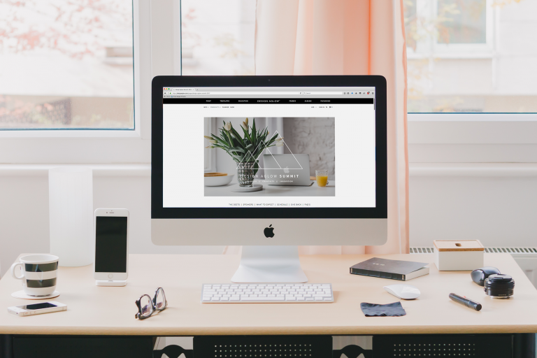 Desktop computer with a plant website open.