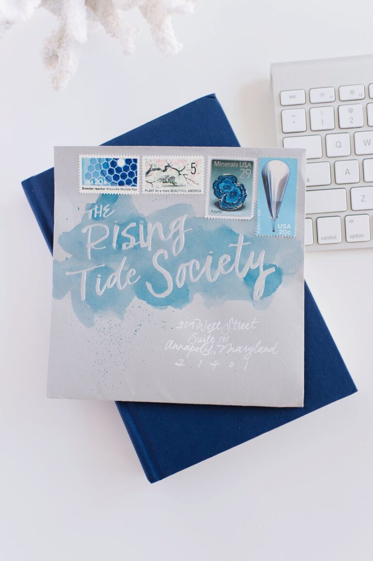 A decorative envelope with calligraphy that reads 