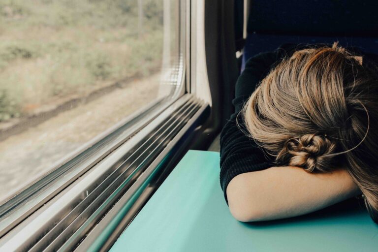 business owner looking burnt out on a train