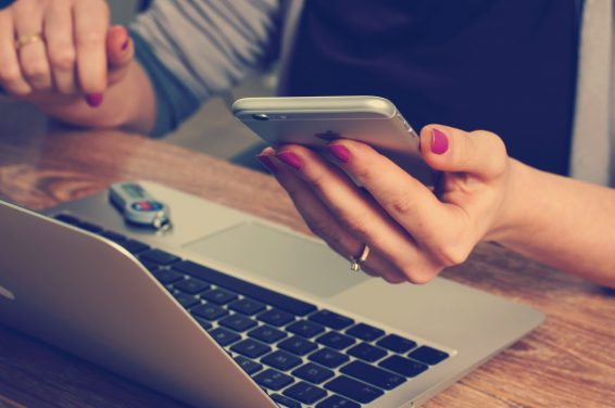 woman holding a phone learning how to reduce bad cellphone habits