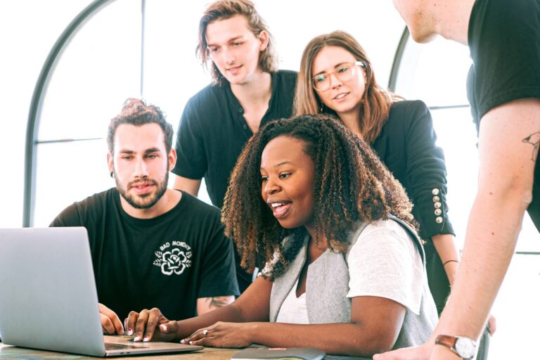 Group of people looking at computer