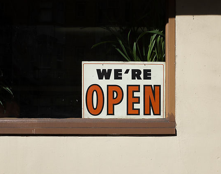 A window with a sign that reads, 