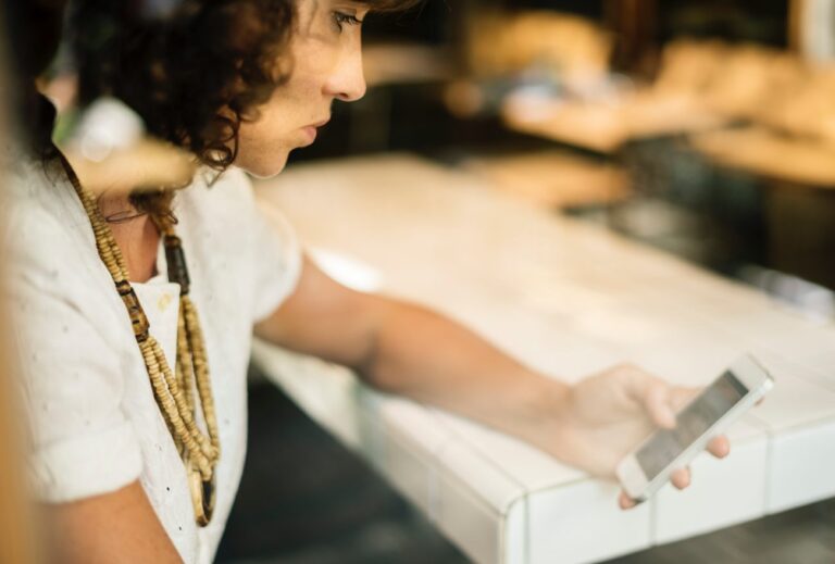 a woman on her laptop learning how to file self-employed taxes