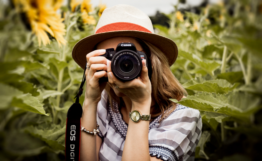 woman using her camera to produce photos for a landing page