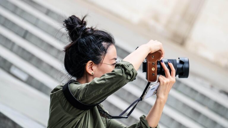 a woman holding a camera