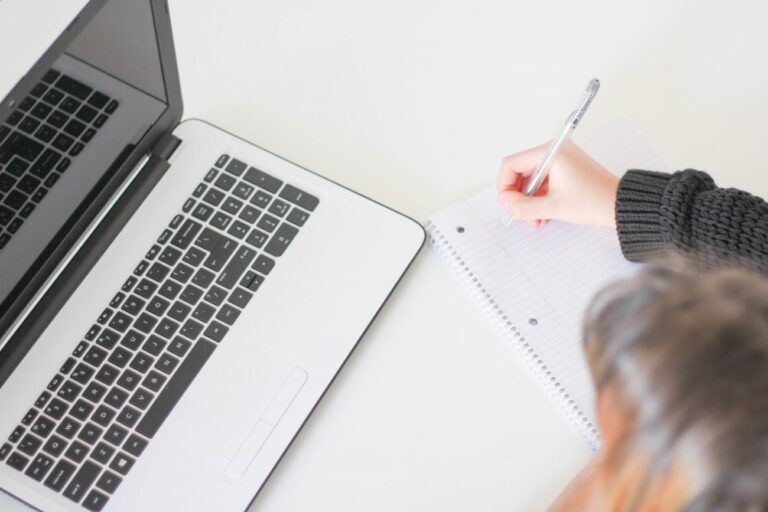 woman at a laptop learning how to diy seo as a small business