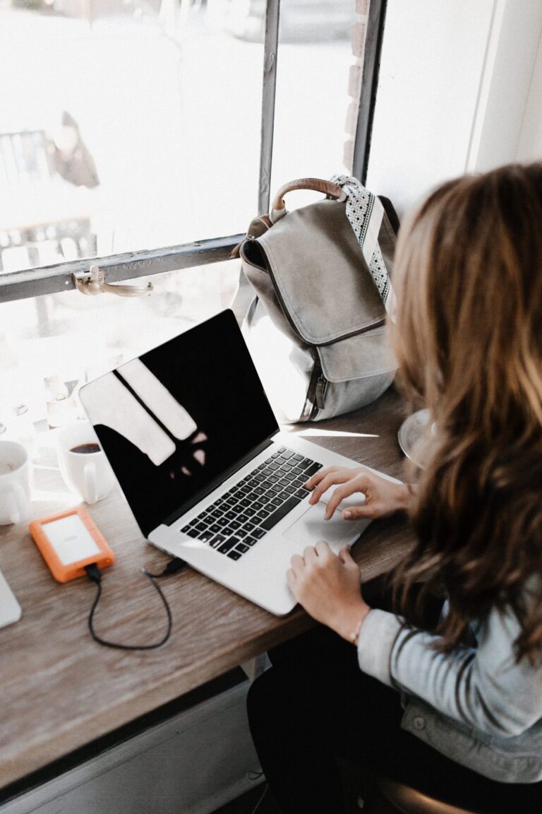 person searching for a mentor on their laptop