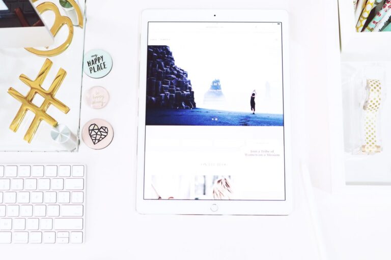 Top down view of an ipad laying on a desk.