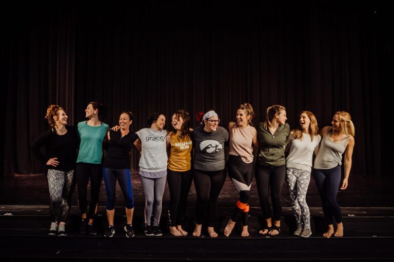 Group of women in athletic wear smiling