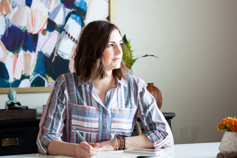 business woman managing time at her desk