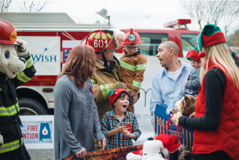 business man and family giving time to the local fire department