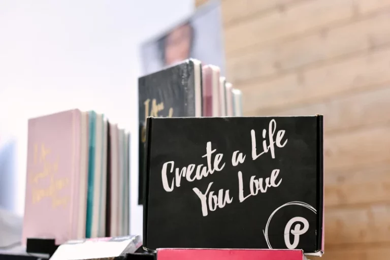 books in a window with a sign that says create a life you love and the pinterest logo