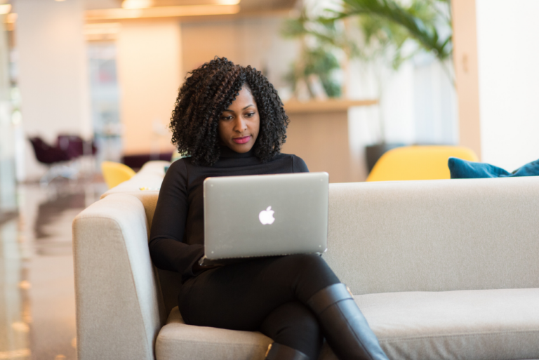 a woman on a laptop learning how to grow revenue with online courses