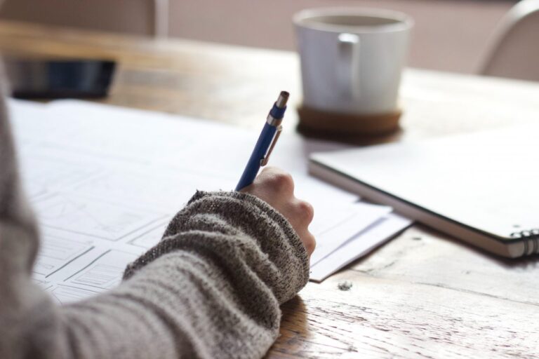 Woman outlining business goals on paper.