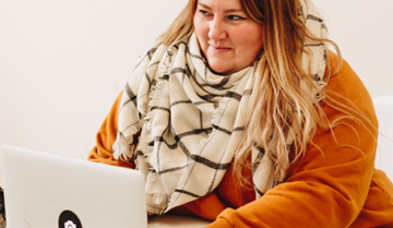 woman using a laptop to connect with others online