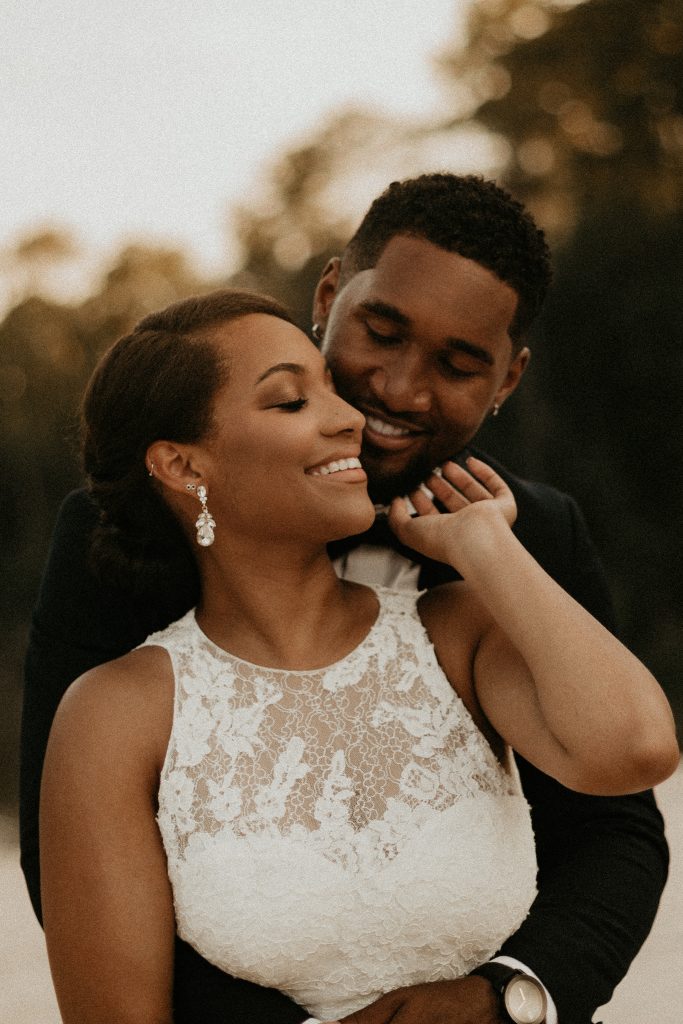 smiling bride and groom