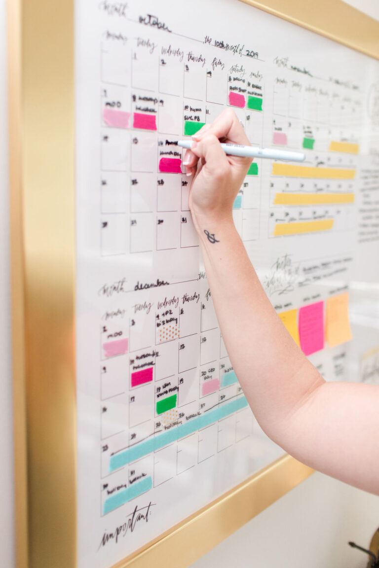 person implementing a management system with a calendar