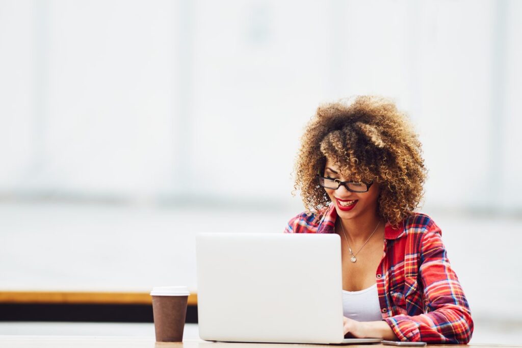 a woman on a laptop learning how to automate her business