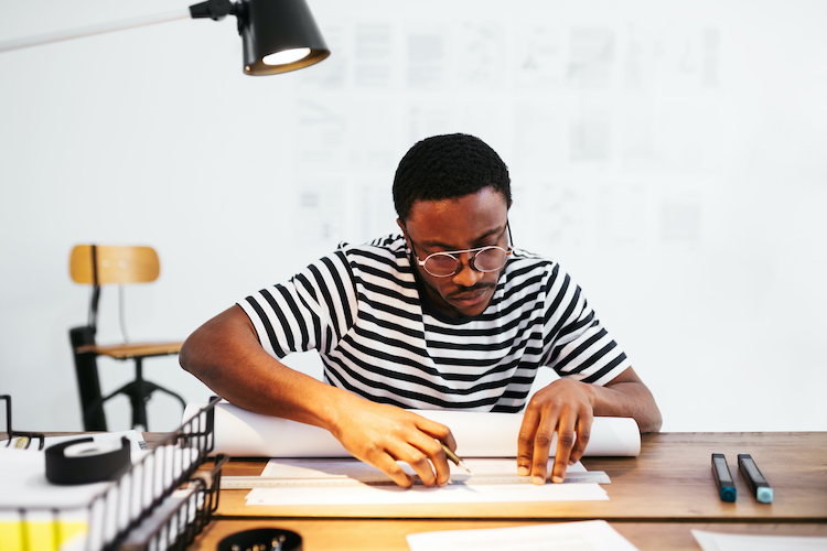 man working at a desk learning How to Create a Professional Invoice and Get Paid Fast