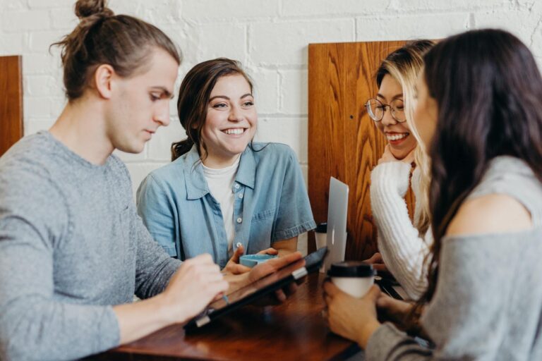 group of people connecting at a local coffee shop