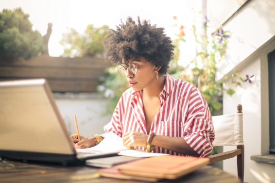 woman at a laptop learning how to attract her dream clients