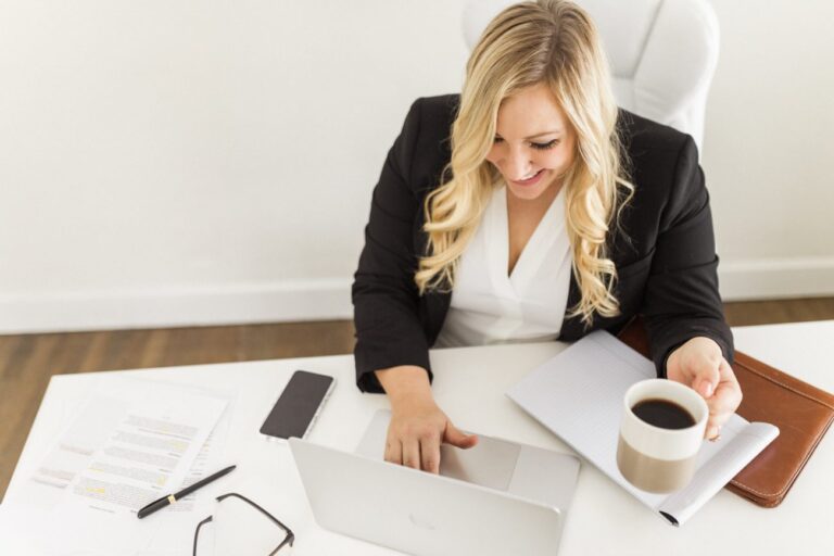 Woman sitting at the desk with a planner