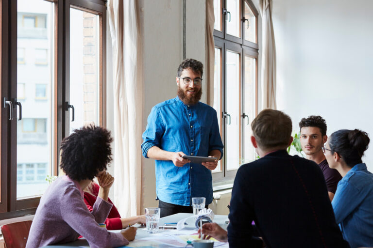 man talking to a group of people about how and when to discount and still profit