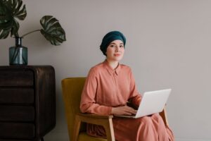 woman on a laptop learning how to evaluate roi of podcasts