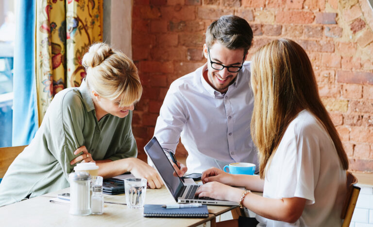 Business Meeting In A Cafe