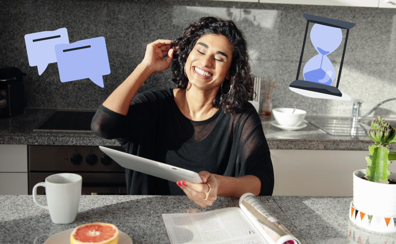 Woman sits in kitchen smiling down at an ipad. There's a speech bubble and hourglass illustration next to her.