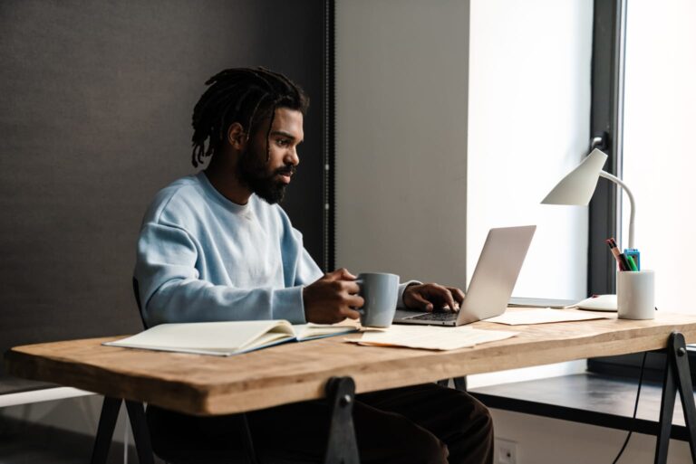 confident young african man freelancer working