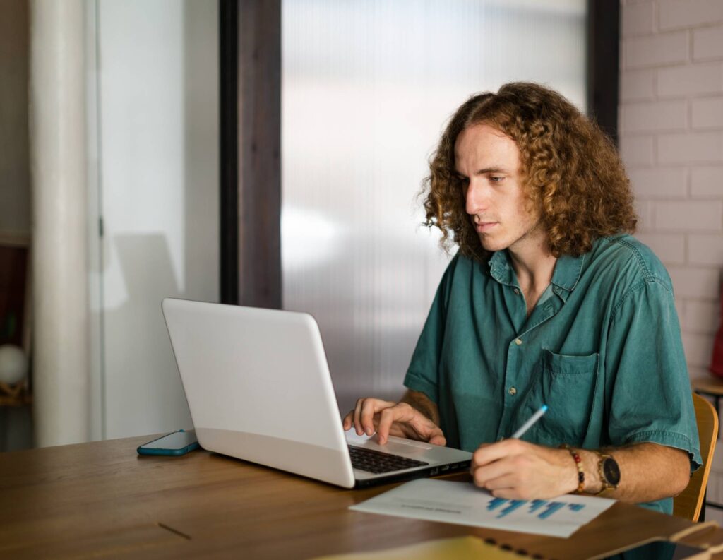 Man writing an invoice email