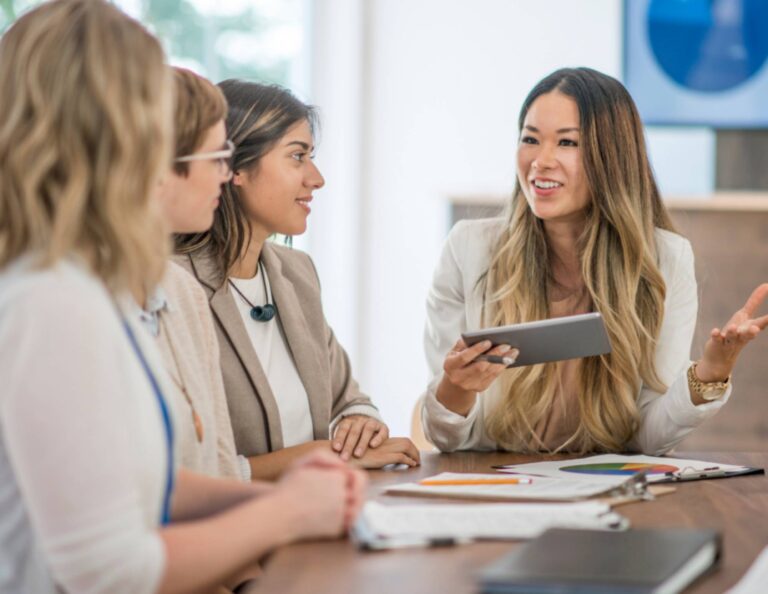 Group of women going through client onboarding in person