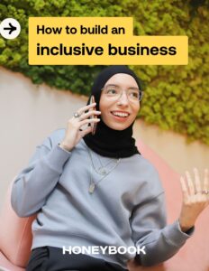 Woman talks on the phone on the cover of how to build an inclusive business guide.
