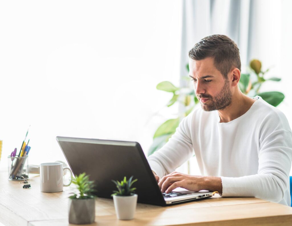 Man on laptop using business process automation