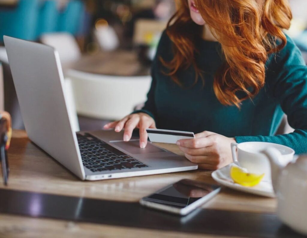 Woman types on computer.