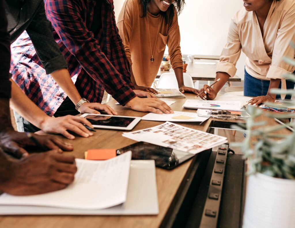 Employees working on a pricing strategy at a table