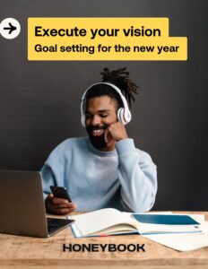 Man laughs wearing headphones on the cover of the Executing Your Goals Guide.