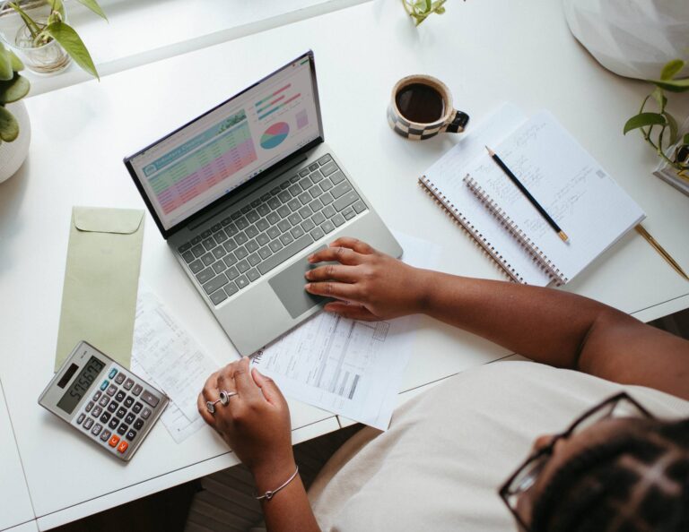 Woman evaluating her finances at a desk