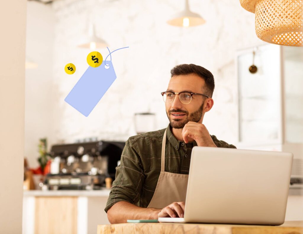 Man setting his pricing strategy at a laptop with price tag illustration