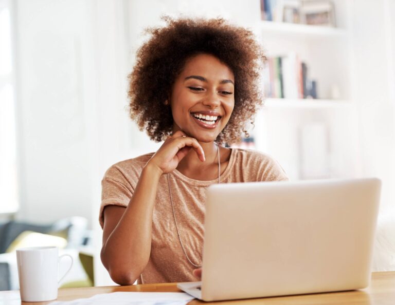 Woman on laptop using a clientflow platform