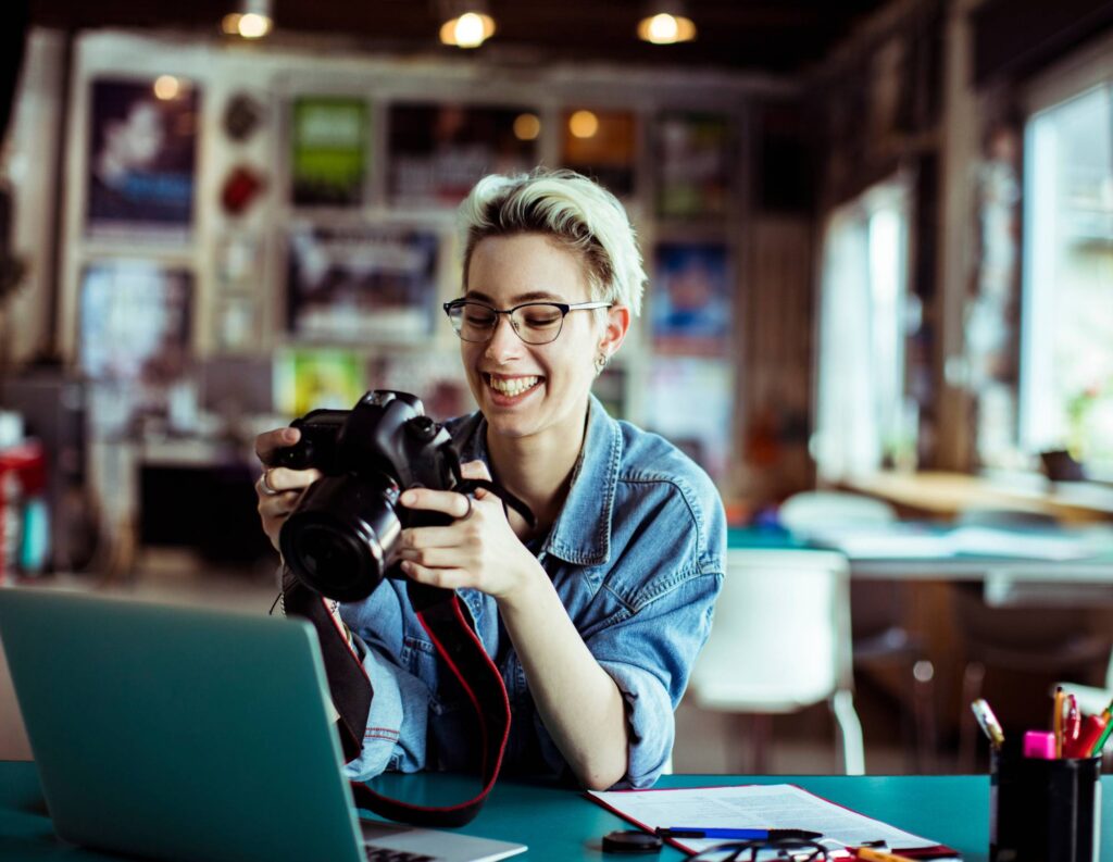 Photographer reviewing photos on a camera