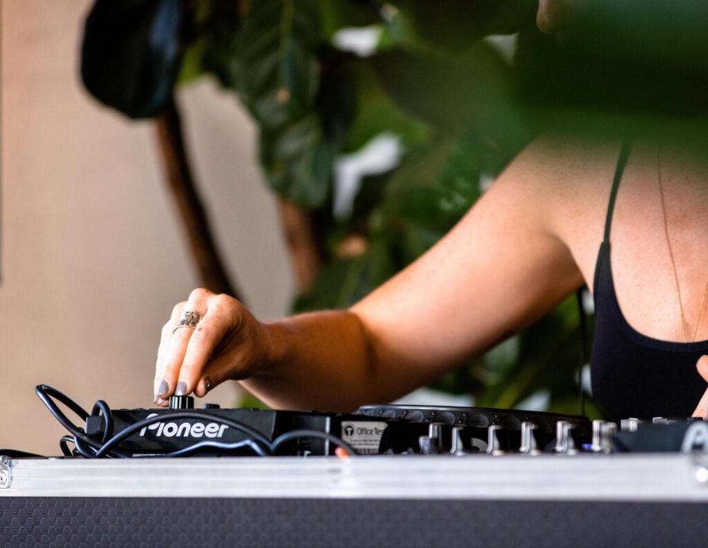 Disc Jockey mixes a song at an event.