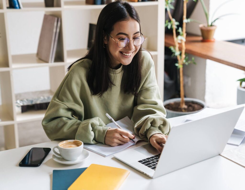 Woman creating a lead magnet on her laptop