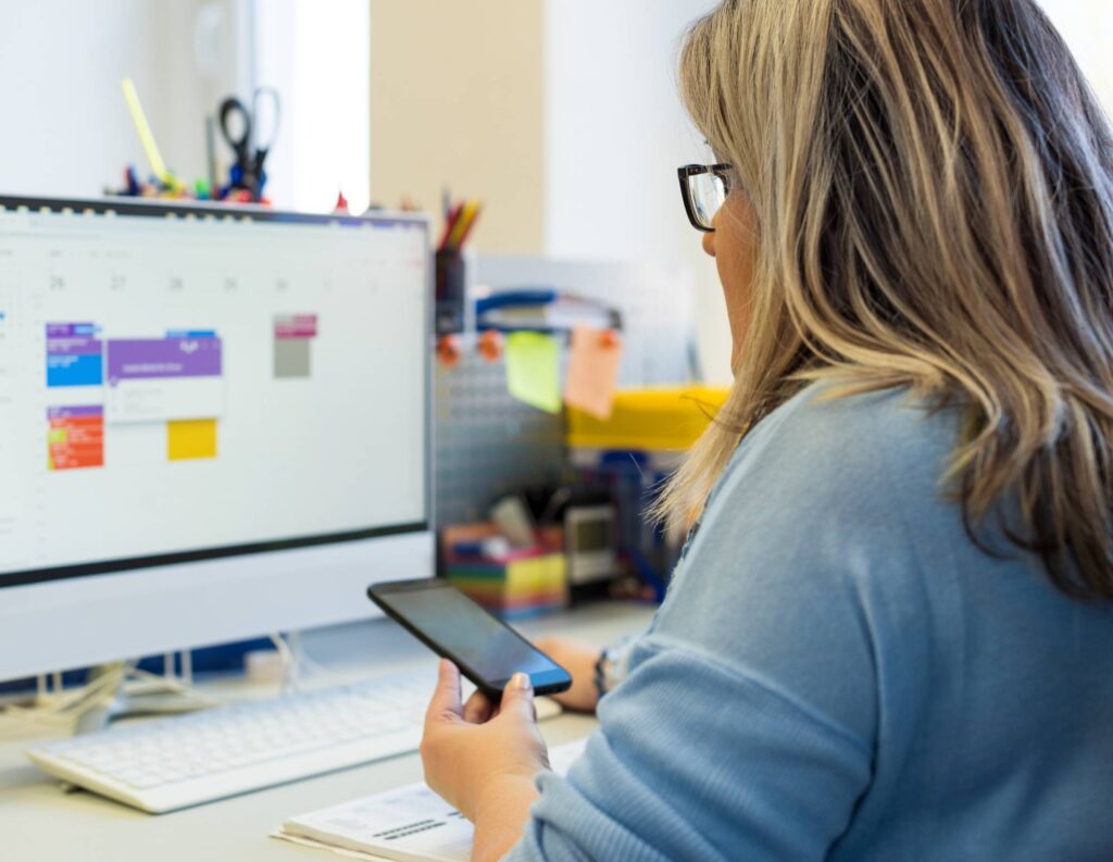 Woman setting up an online booking calendar