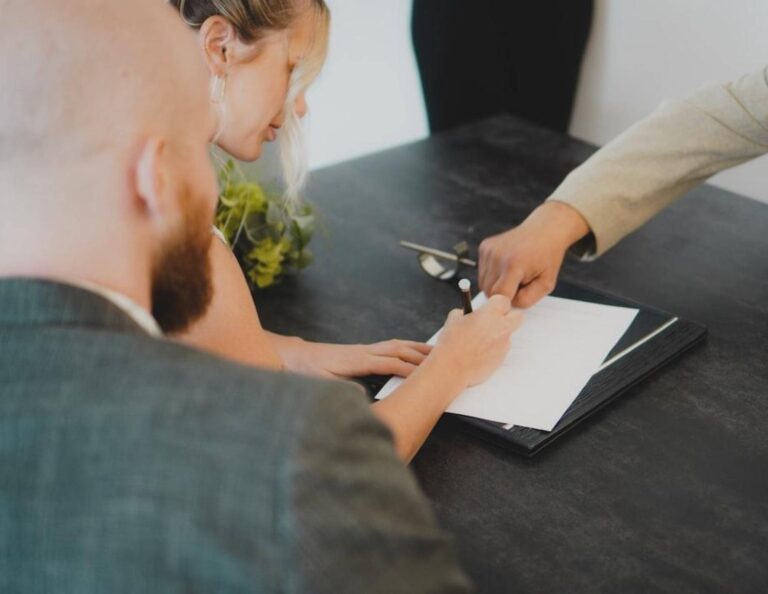 People signing a contract for service